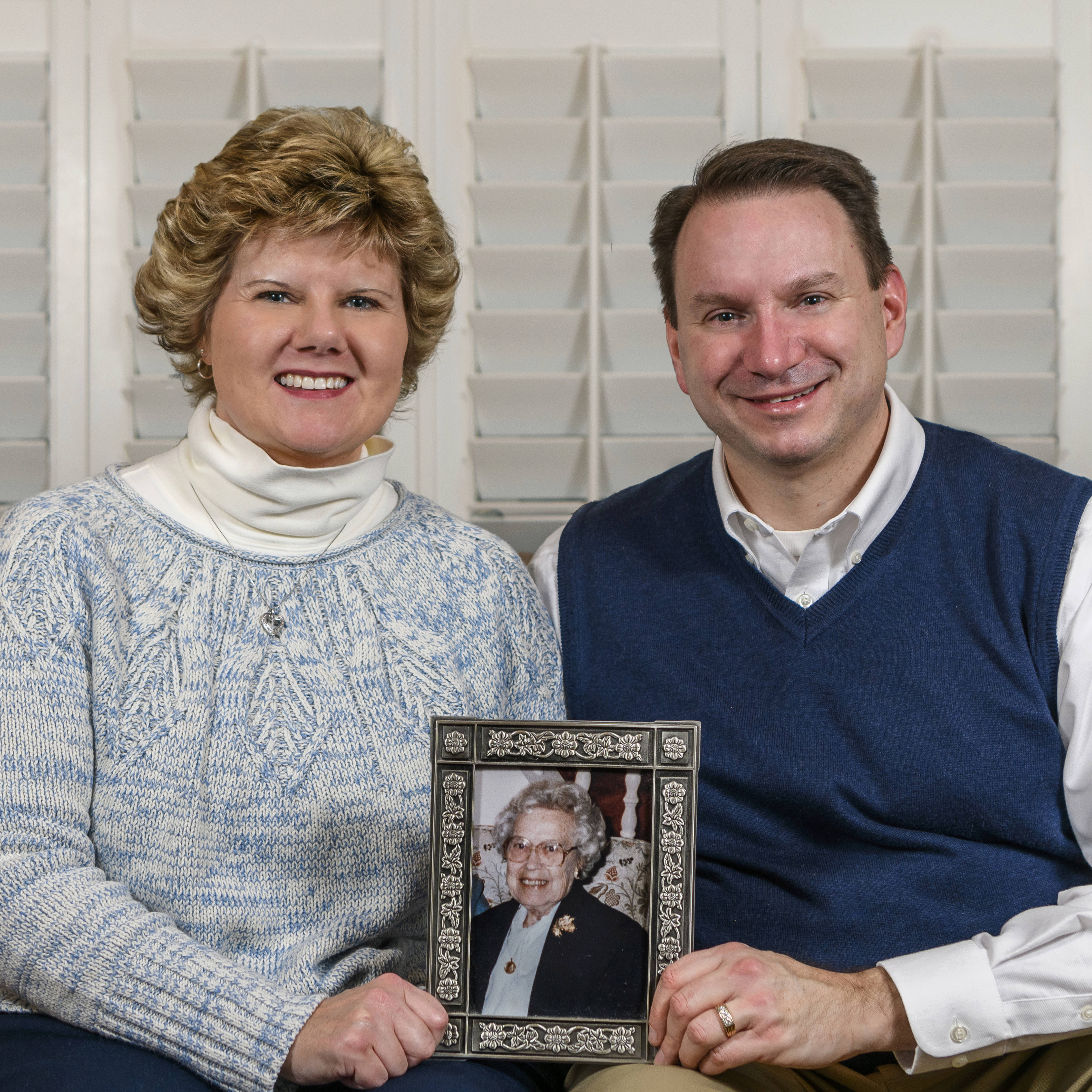 Dan and Tracy Aunkst with a photo of Dan's aunt, Betty DeFeo, for whom the scholar